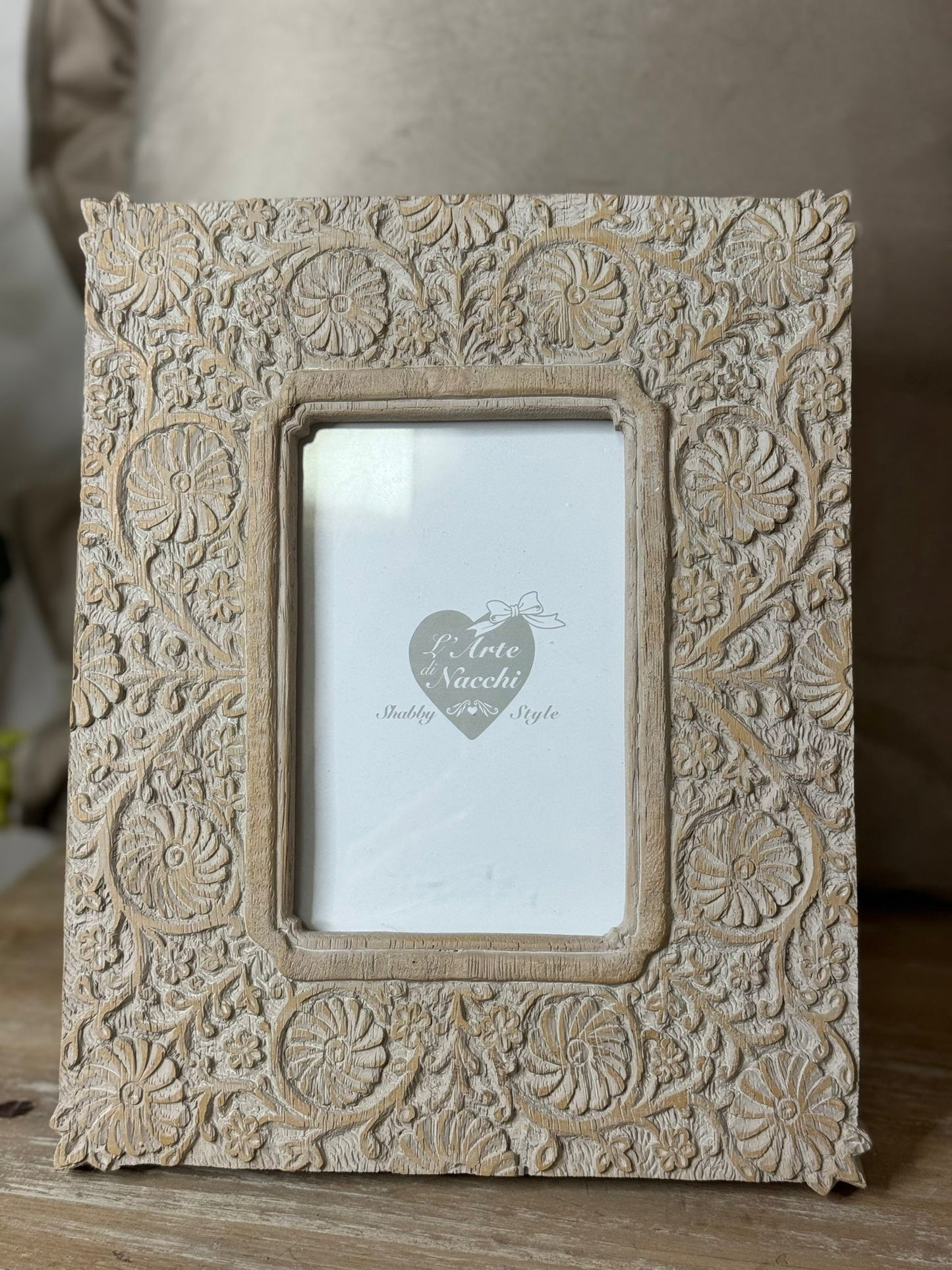 Cornice-portafoto beige con fiori