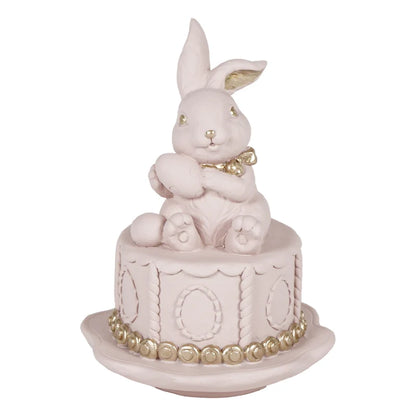 Coniglio su torta rosa con dettagli dorati in resina | Plathea
