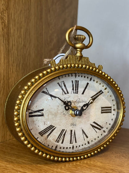 Orologio dorato da tavolo