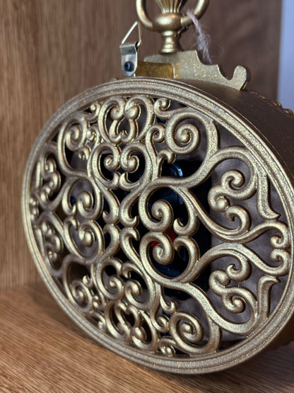 Orologio dorato da tavolo