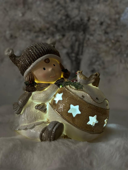 bambina con sfera di Natale