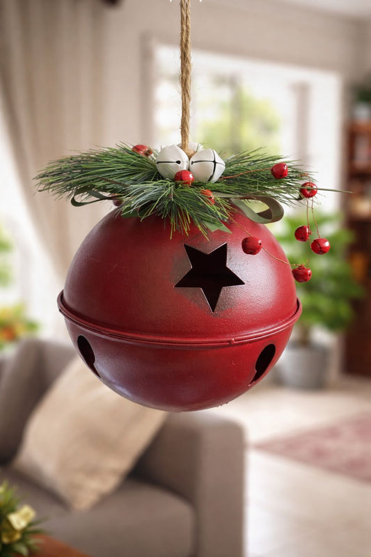 Campana decorata con rami di pino
